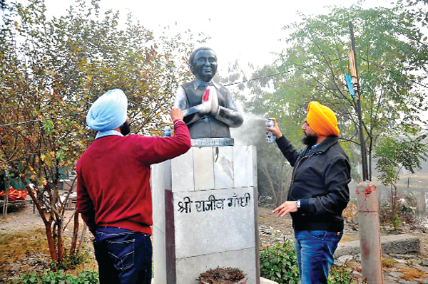 The Youth Akali Dal's Kalikh Mali on the statue of Rajiv Gandhi